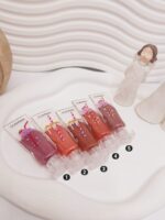 رژ مایع شاین شیشه ای طرح آیس پکی کد 1091 - فروشگاه عمده لوازم آرایشی کالای سید