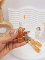 لیپ گلاس ذرات طلا برند MAGIC کد LC235 - فروشگاه عمده لوازم آرایشی کالای سید